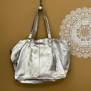 WHBM metallic silver leather purse with liner, tassel & studded handles NWOT